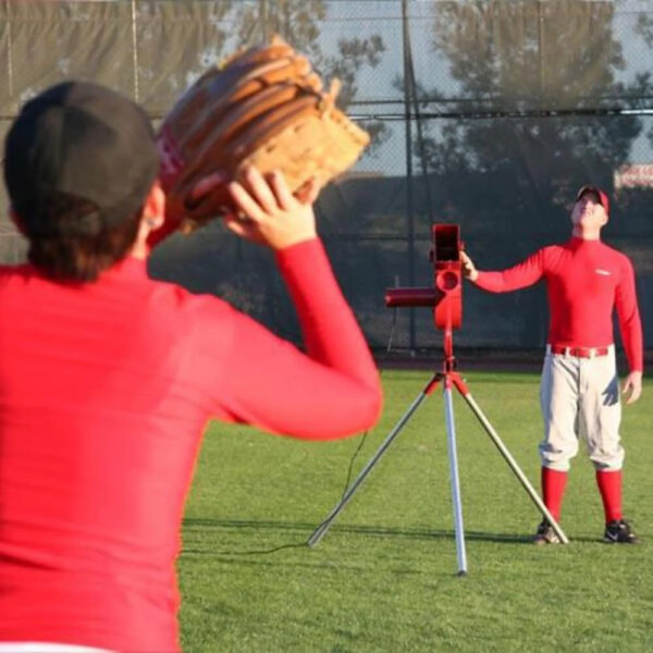 ba7d4c28c1f04bee8efa9af3968390a2 Sports Softball Pitching Machine with 9 Ball Automatic Feeder