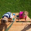 Backyard Discovery Mount Mckinley Cedar Wood Swing Set with Wave Slide, Play Deck, Double Rock Wall, Rope Ladder, Web Swing, Belt Swings, Toy Telescope, Steering Wheel, Sandbox Area, Outdoor Playset