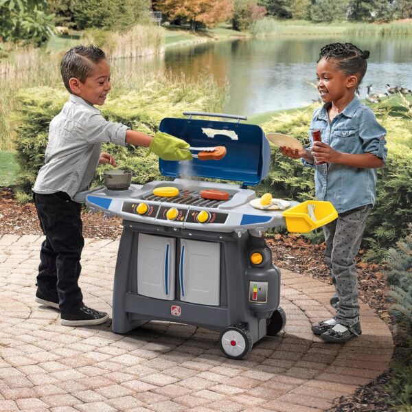 f093bad12f1b4f3892bc07d14d02fcd6 Step2 Sizzle & Smoke BBQ Grill Kids Playset, Indoor/Outdoor Kitchenette, Interactive Play with Sounds, Made of Durable Plastic, Includes 15 Piece Toy Accessories, For Toddlers 3+ Years Old