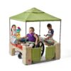 Step2 All-Around Playtime Patio with Canopy with 16 Play Accessories Playhouse Kids Outdoor Toys